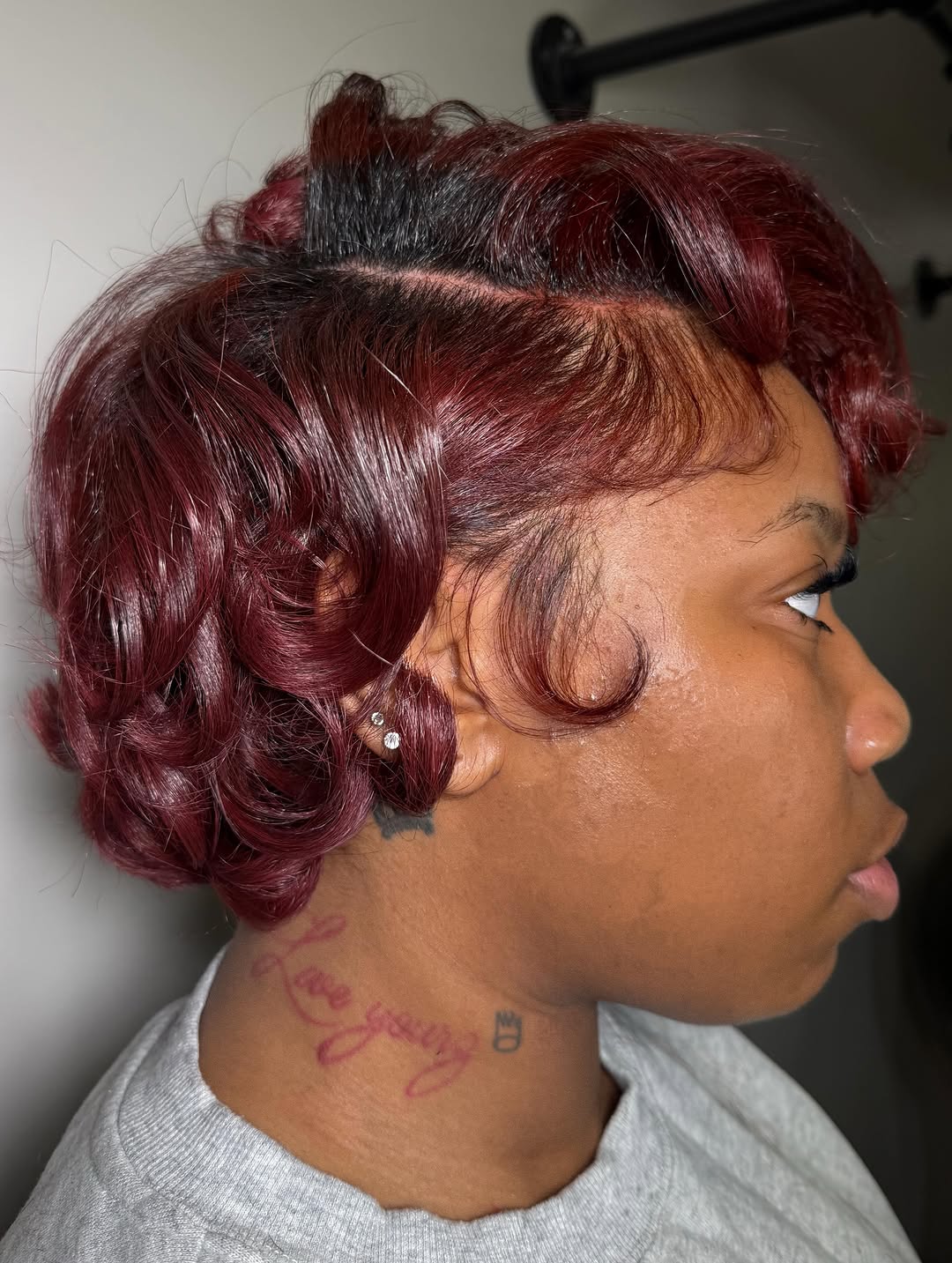 Burgundy curled hairstyle by Hair by D